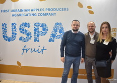 Volodymyr Gurzhiy, Dmytro Kroshka and Sophia Kushch from the USPA, a Ukranian company showcasing their apples.